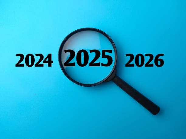 istock Magnifying glass and 2025 concept with word and blue background 2188461231