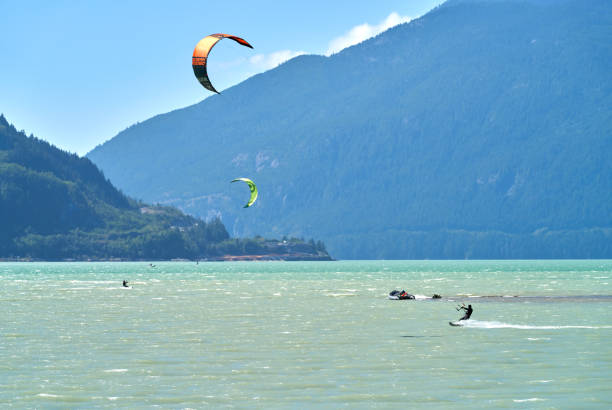 Kiteboarders catching the wind off Squamish Spit where the Squamish River empties into the head of Howe Sound. August 29, 2020.