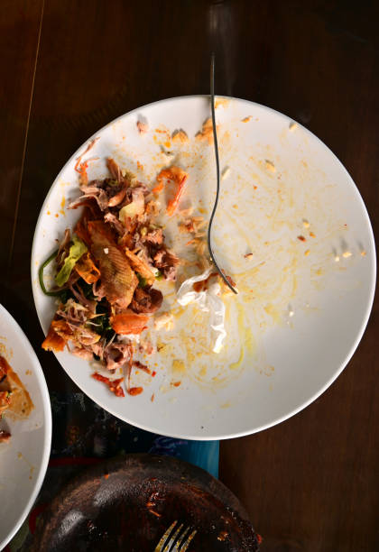 istock Leftover food on a table in a restaurant in Asia. 2188465244