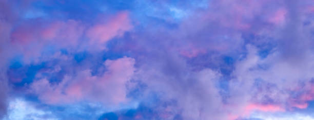 istock Cloudscape. Blue sky with pink and purple cumulus clouds in the evening at sunset. Cloudy wallpaper. Natural background for design. Up view. Magic beauty in nature. Copy space. Morning colors 2188479721
