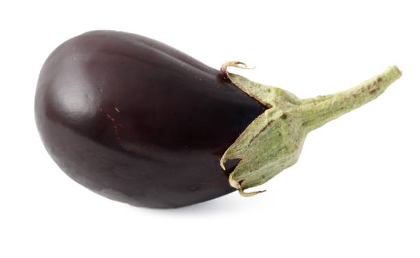 istock A purple eggplant is shown with its stem and leaf 2188479788