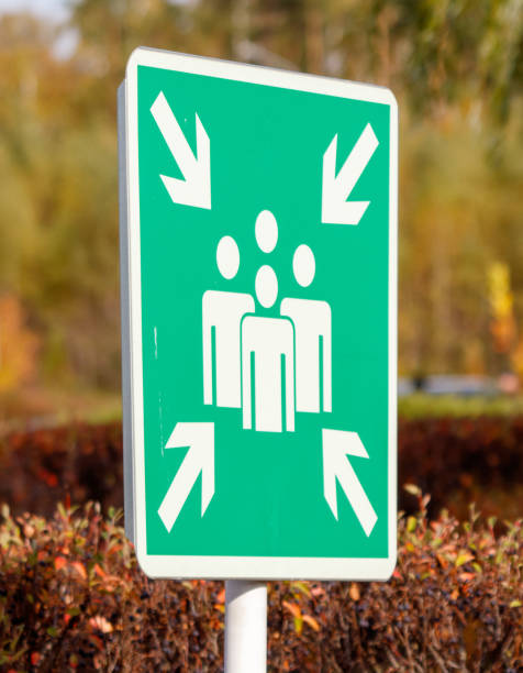 istock A green sign with three people and arrows pointing in different directions 2188480417