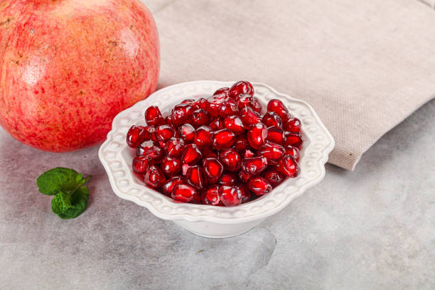 istock Ripe sweet red pomegranate seeds 2188481180