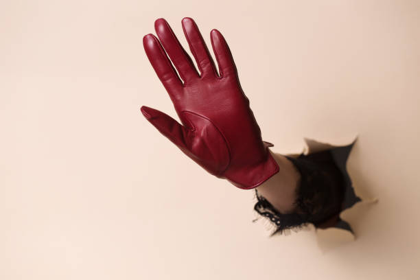 istock A woman's hand in a leather glove waving his hand 2188483589