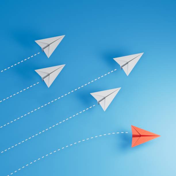 istock Red paper origami plane have individual direction from unique white planes in different way. Business strategy and opportunity concept.3D rendering on blue background. 2188484924