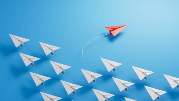 istock Red paper plane floating between others on light blue background, flat lay. Uniqueness concept.new ideas. paper art style. creative idea.3D rendering on blue background. 2188484939