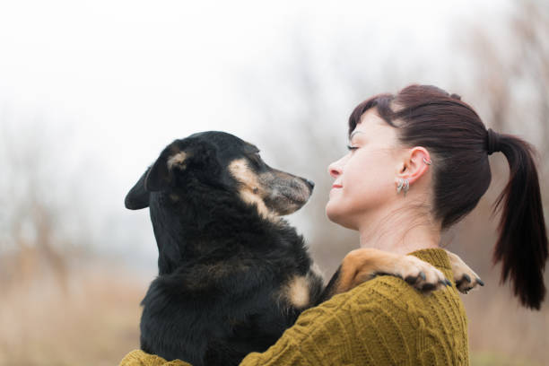 istock Woman and shepherd dog hugging on a walk 2188486975