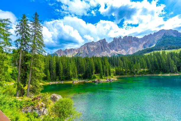 istock Karersee lake reflecting latemar mountain range in dolomites, italy 2188487465