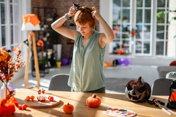 istock Adjusting hair with Halloween headband decoration 2188489540