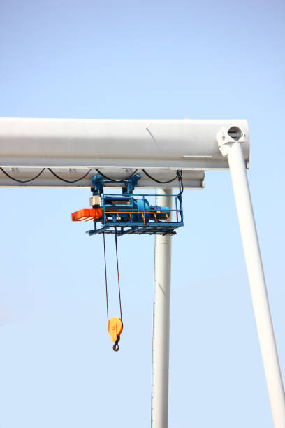 istock outdoor two eletric hoists moter set on beam against blue sky 2188491394