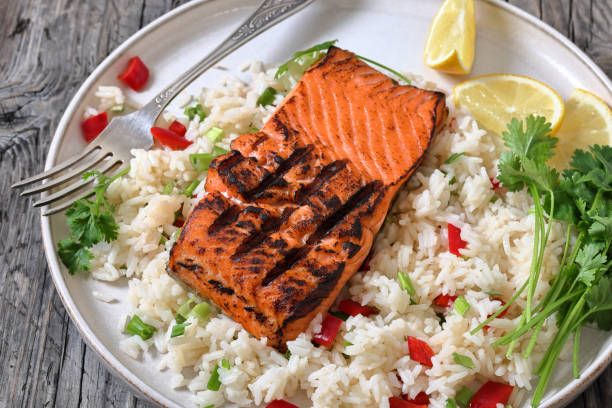 istock grilled red salmon fillet with rice, top view 2188491500