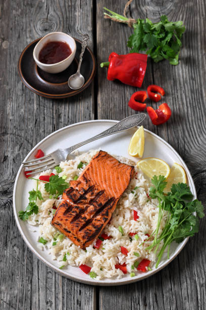 istock grilled red salmon fillet with rice, top view 2188491931