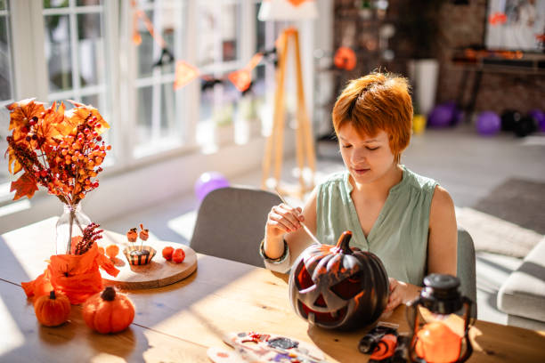 istock Creative Halloween activity: painting pumpkins indoors 2188492269