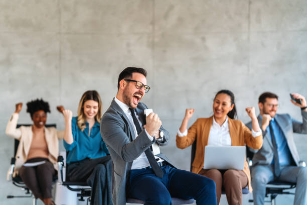 istock Multicultural professional businesspeople working together on research plan in boardroom. 2188494973