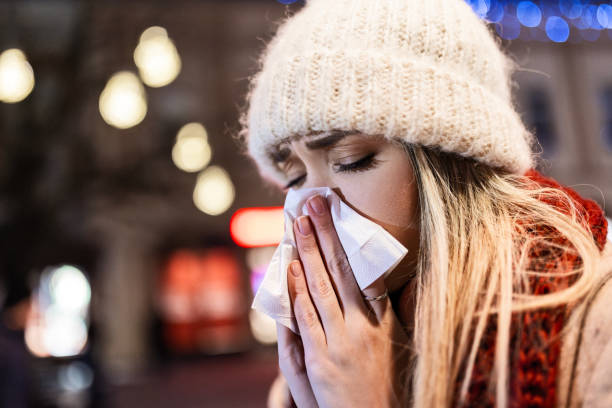 istock Young Woman Fighting a Cold While Walking Outside 2188497211