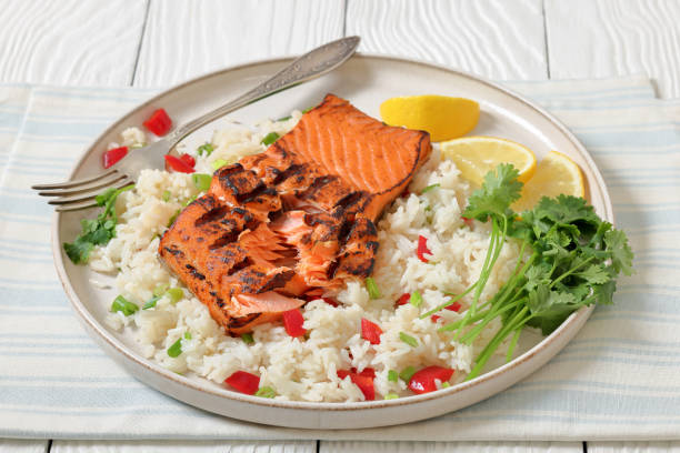 istock grilled red salmon fillet with rice, top view 2188498101