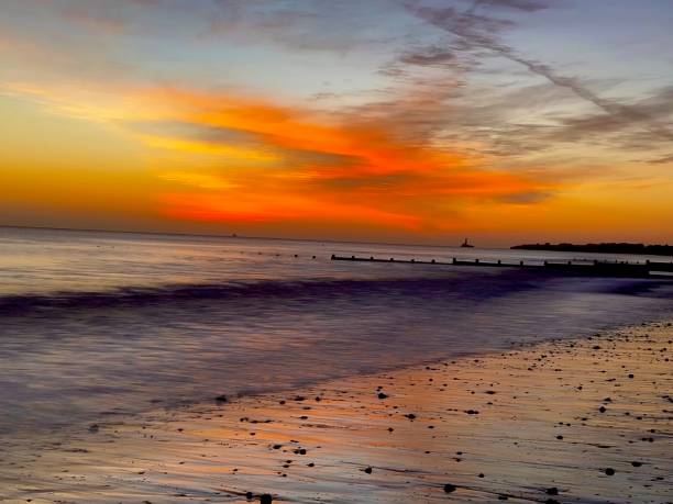 istock Sunrise colours reflected on Blyth beach in Northumberland in long exposure 2188498255