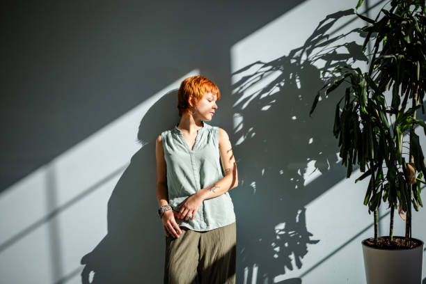 istock Woman enjoying calm sunlight shadows and greenery 2188499164
