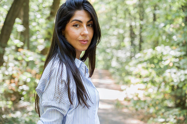 istock Beautiful  brunette woman in summer park 2188499814
