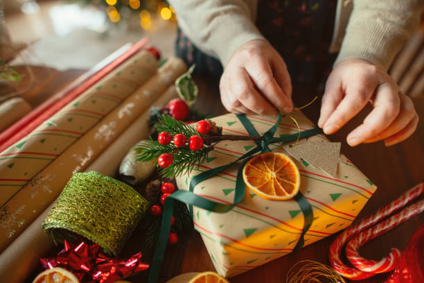 istock Woman preparing Christmas gifts 2188501356
