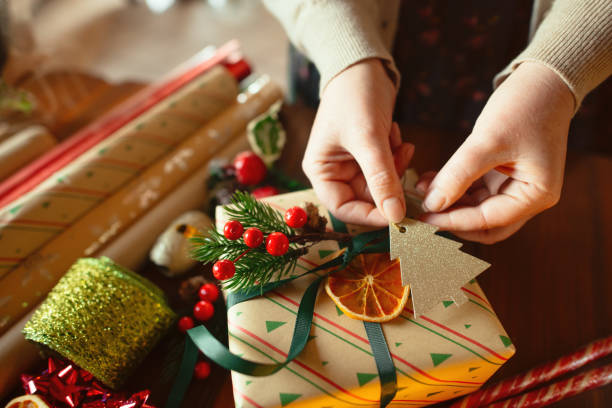 istock Woman preparing Christmas gifts 2188501374