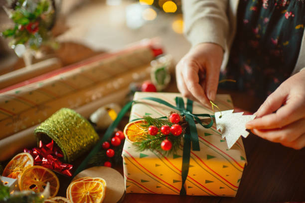 Woman preparing Christmas gifts