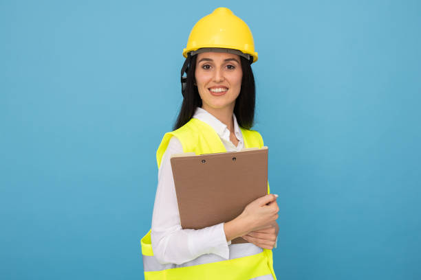 istock Female architect with helmet and vest ready for work 2188502234