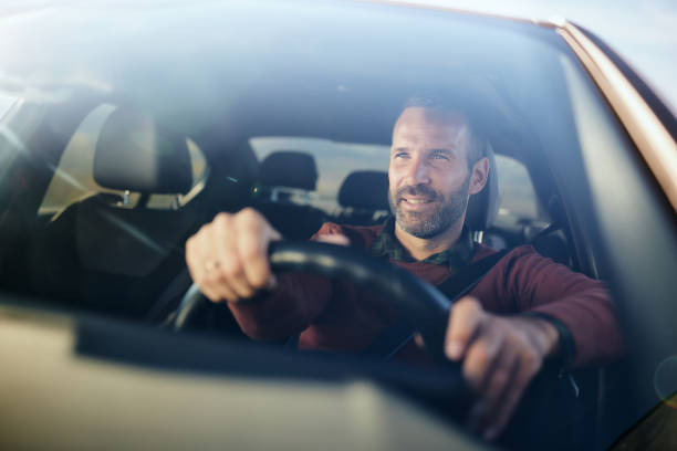 istock Happy man enjoying while driving a car. 2188502678