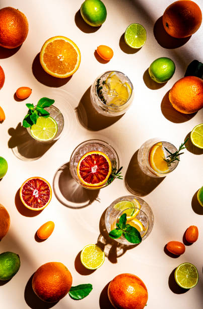 istock Gin and citrus cocktails, top view. Beige background, hard light, shadow pattern, top view 2188503854