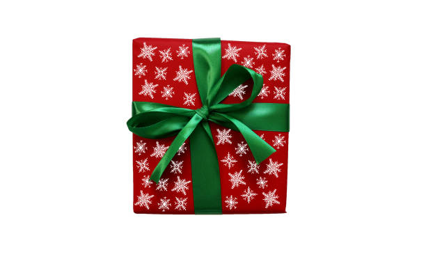 istock Gift isolated on white background. Square red box with green ribbon and bow. Filled with various snowflakes. 2188504282