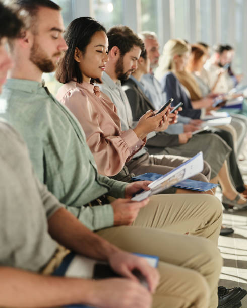 istock Chinese businesswoman using smart phone while waiting for a job interview. 2188504334