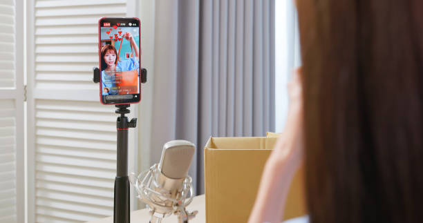 istock woman live stream selling clothes 2188504939