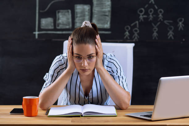 istock Beautiful young woman stressing at work 2188507494