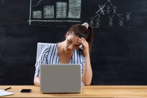 istock Beautiful young woman stressing at work 2188508099