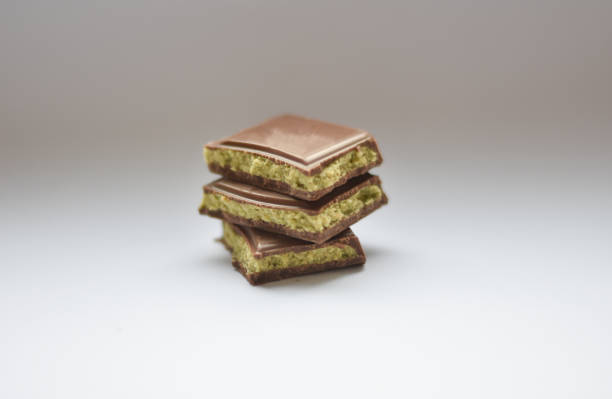 istock Dubai Chocolate bar with green kadayif and peanut butter on white background 2188512296