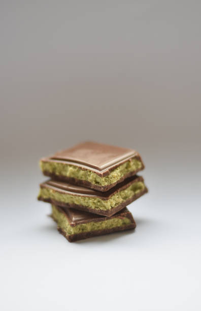 Top view with cocoa powder and delicious chocolate on wooden background