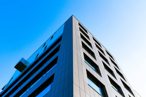 istock Minimalist Residential Building with Clean White Facade and Symmetrical Windows Under a Clear Sky 2188513322