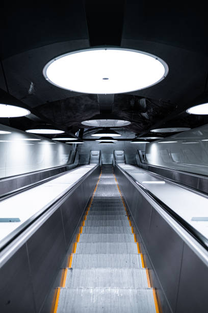 Futuristic Underground Escalator with Bright Overhead Lights Creating Modern and Minimalistic Subway Atmosphere in Urban Environment for Transportation and Infrastructure Themes