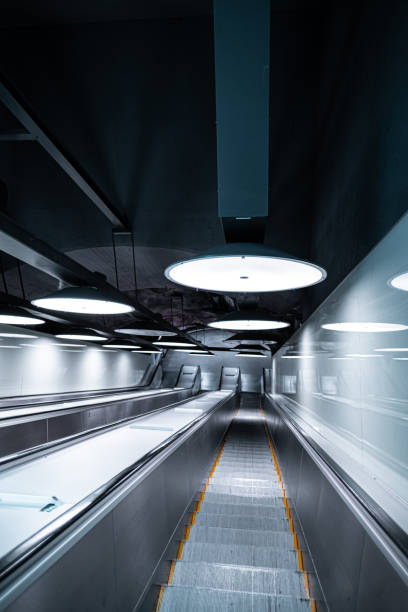 istock Futuristic Underground Escalator Tunnel with Modern Circular Lighting in Sleek Metal Interior 2188513459