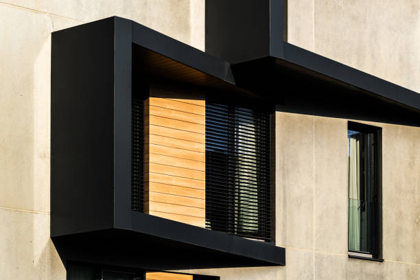 istock Modern Architectural Facade with Geometric Protrusions and Reflective Windows in Sunlight 2188513506