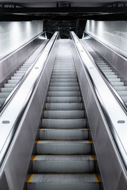istock Modern Escalator in a Brightly Lit Underground Setting, Portraying Urban Architecture and Transportation Transition 2188513512
