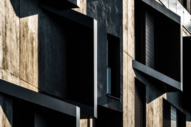 istock Modern Architectural Facade with Geometric Protrusions and Reflective Windows in Sunlight 2188513548