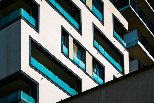 istock Modern Architectural Facade with Geometric Protrusions and Reflective Windows in Sunlight 2188514169