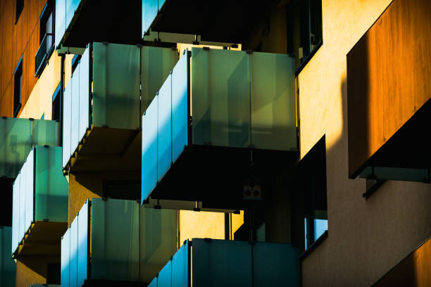 istock Modern Architectural Facade with Geometric Protrusions and Reflective Windows in Sunlight 2188514336