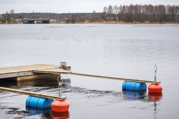istock .A boat dock with a boardwalk and buoys on the water 2188517048