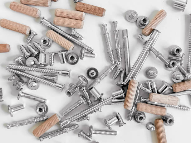 istock Assorted hardware pieces. Screws, dowels, and fasteners on white background 2188517778