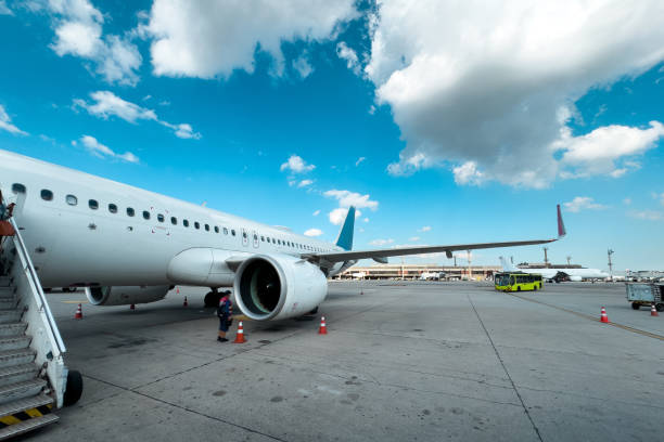 istock Airplane ready for boarding in a airport hub at blue sky 2188517896