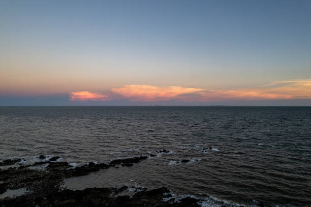 The rocks and the sea at dusk