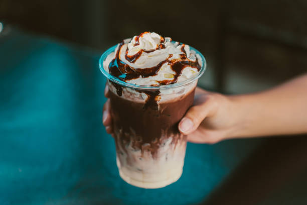 istock Delicious chocolate milkshake topped with whipped cream and syrup 2188519782