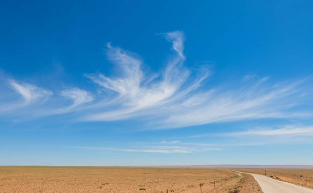 istock Grassland and rural roads under blue sky and white clouds, Inner Mongolia, China 2188520117
